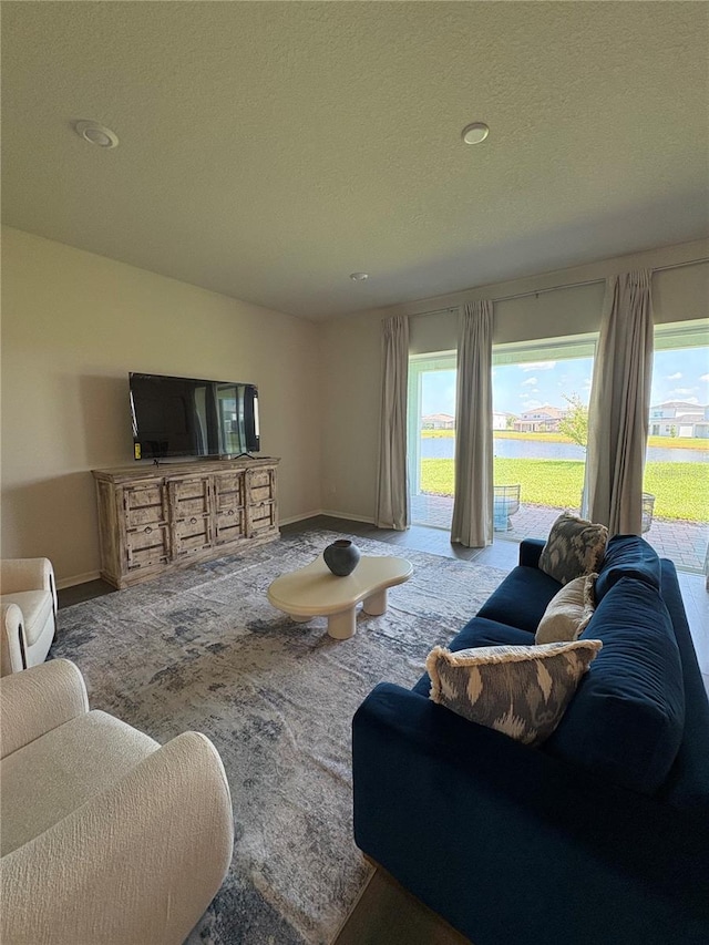 8243 Fenton St, Orlando, FL 32836 - living area featuring carpet flooring and a textured ceiling