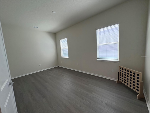 8243 Fenton St, Orlando, FL 32836 - empty room featuring dark wood-style flooring