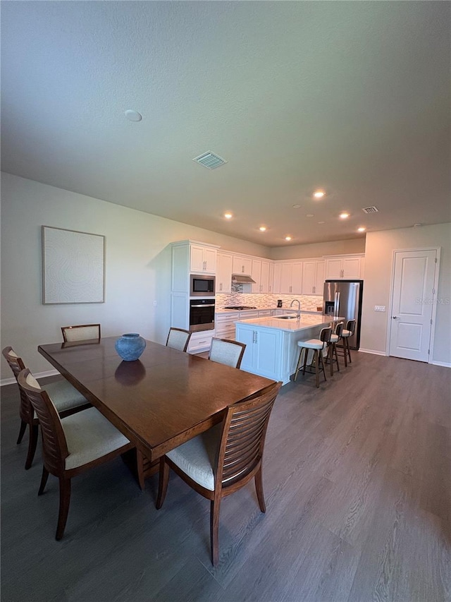 8243 Fenton St, Orlando, FL 32836 - dining space with wood finished floors and recessed lighting