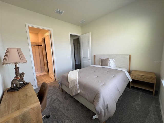 8243 Fenton St, Orlando, FL 32836 - carpeted bedroom featuring ensuite bath