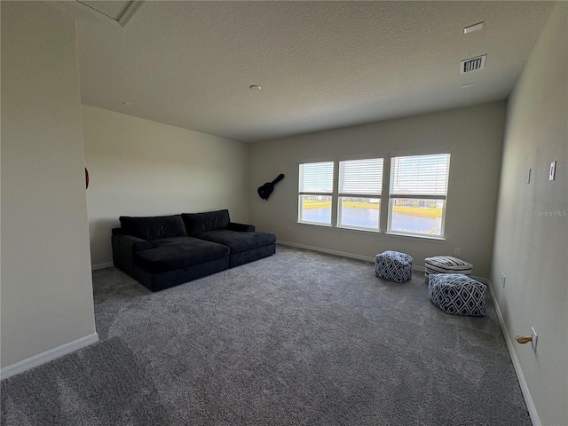 8243 Fenton St, Orlando, FL 32836 - carpeted living area featuring baseboards and a textured ceiling
