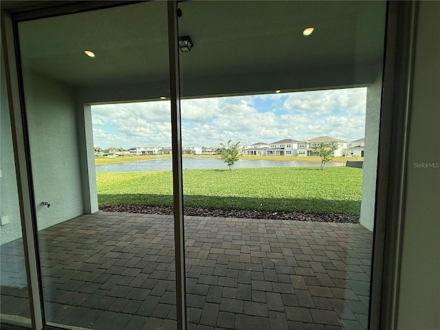8243 Fenton St, Orlando, FL 32836 - doorway with a water view, a residential view, plenty of natural light, and recessed lighting