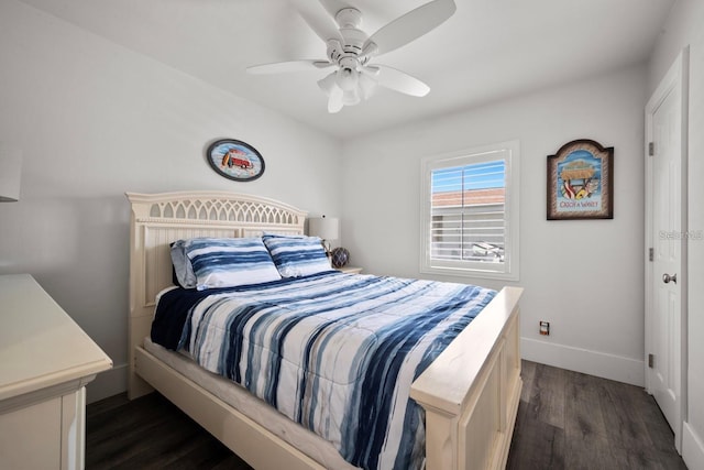 bedroom with a ceiling fan, baseboards, and dark wood finished floors
