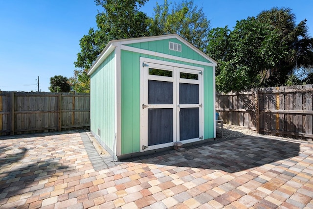 view of shed featuring a fenced backyard