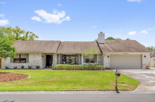 1558 Regal Oak Dr, Kissimmee, FL 34744 - ranch-style house with a garage, driveway, a front lawn, and brick siding