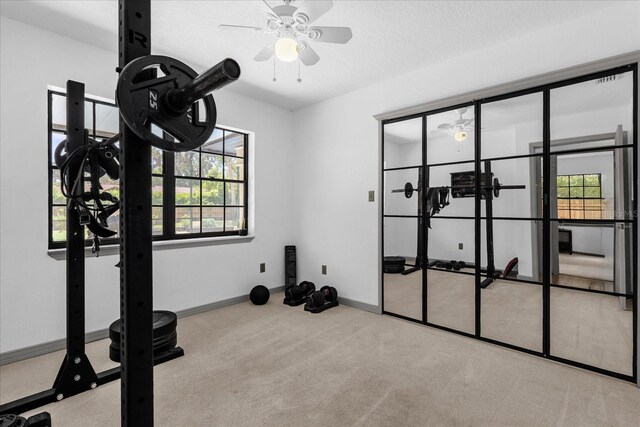 1558 Regal Oak Dr, Kissimmee, FL 34744 - exercise area featuring baseboards, carpet flooring, and ceiling fan
