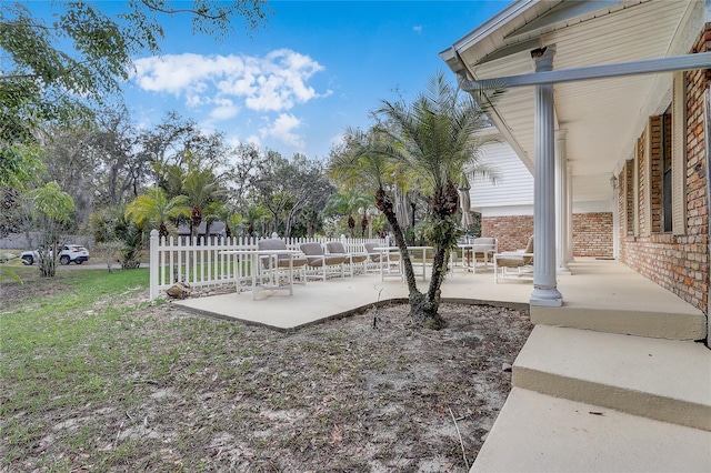 view of yard featuring fence and a patio area