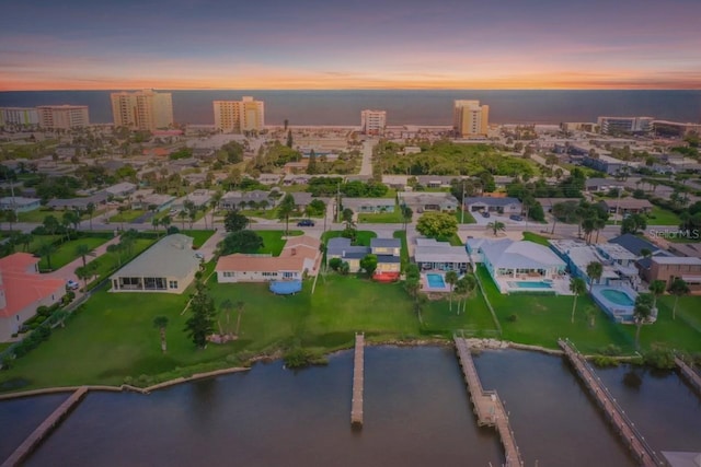 aerial view featuring a water view and a city view
