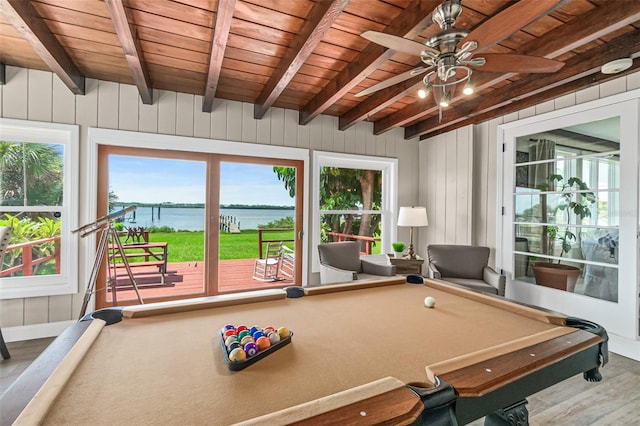 recreation room featuring plenty of natural light, a water view, pool table, and wood ceiling