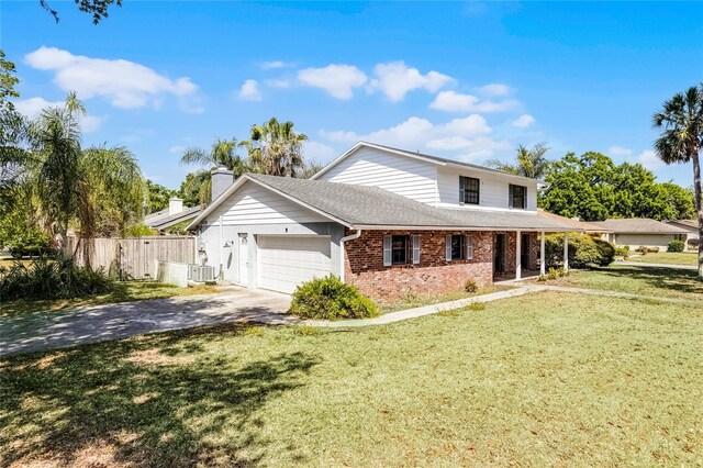 view of front of property featuring driveway, a chimney, fence, brick siding, and a garage
