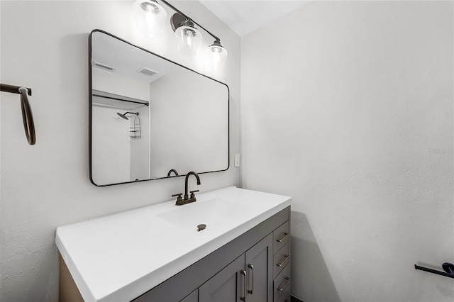 bathroom with visible vents and vanity