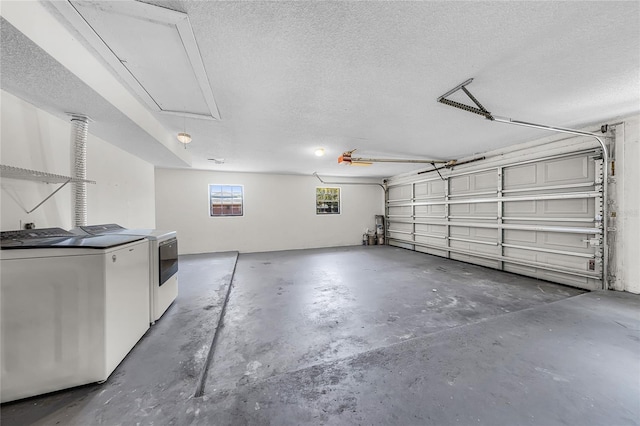 garage with washer and clothes dryer