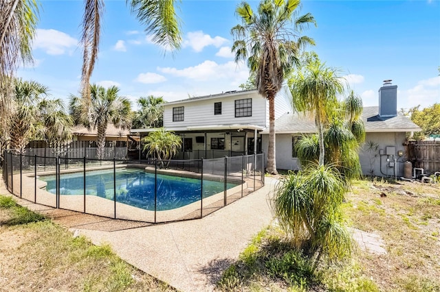 view of pool with a patio, fence, and a fenced in pool