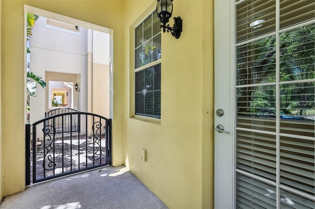 8639 Lower Villagewalk Cir, Orlando, FL 32827 - doorway to property with stucco siding and a gate