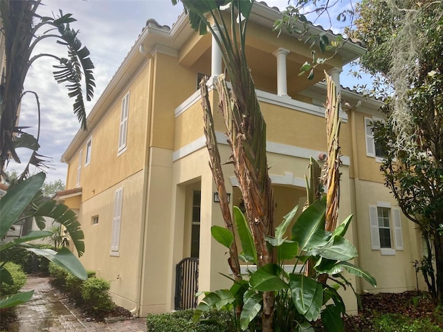 8639 Lower Villagewalk Cir, Orlando, FL 32827 - view of property exterior with stucco siding