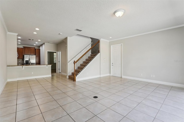 8639 Lower Villagewalk Cir, Orlando, FL 32827 - unfurnished living room featuring recessed lighting, stairway, crown molding, light tile patterned flooring, and a textured ceiling