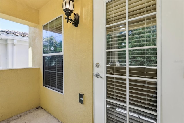 8639 Lower Villagewalk Cir, Orlando, FL 32827 - view of exterior entry with stucco siding