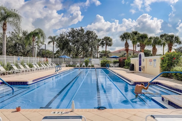 8639 Lower Villagewalk Cir, Orlando, FL 32827 - community pool with a patio area