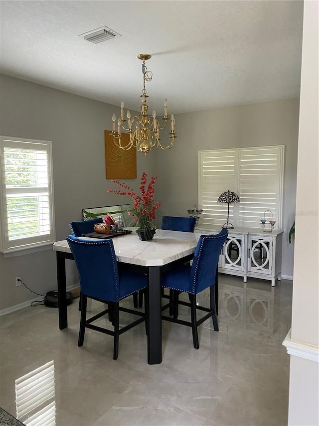 12706 Magnolia Bay Blvd, Clermont, FL 34711 - dining area featuring a chandelier and baseboards