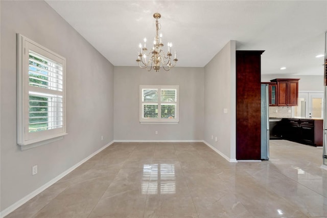 12706 Magnolia Bay Blvd, Clermont, FL 34711 - unfurnished room featuring a chandelier and baseboards