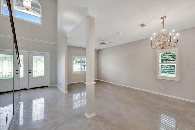 12706 Magnolia Bay Blvd, Clermont, FL 34711 - entryway featuring light tile patterned floors, a chandelier, and ceiling fan