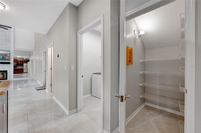 12706 Magnolia Bay Blvd, Clermont, FL 34711 - hallway with washer / clothes dryer and baseboards