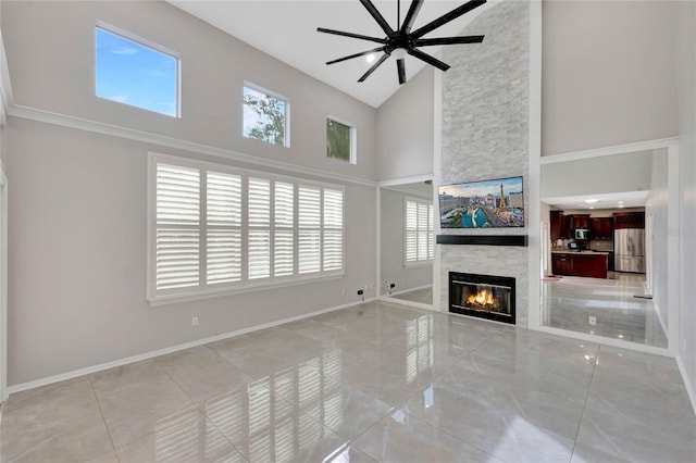 12706 Magnolia Bay Blvd, Clermont, FL 34711 - unfurnished living room featuring high vaulted ceiling, a fireplace, and a ceiling fan