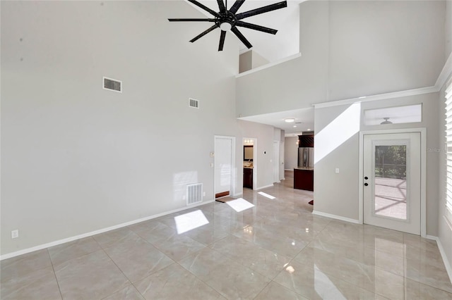 12706 Magnolia Bay Blvd, Clermont, FL 34711 - unfurnished living room featuring ceiling fan and a high ceiling