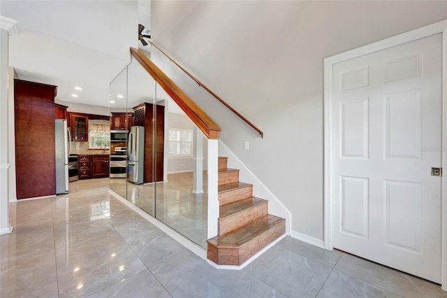 12706 Magnolia Bay Blvd, Clermont, FL 34711 - staircase featuring baseboards and recessed lighting