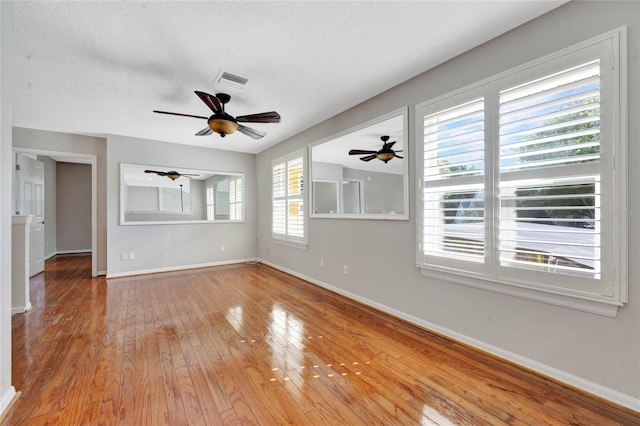 12706 Magnolia Bay Blvd, Clermont, FL 34711 - unfurnished room with a ceiling fan and hardwood / wood-style floors