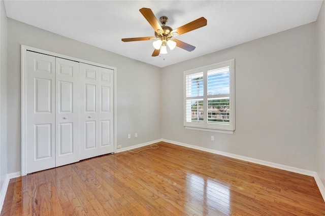 12706 Magnolia Bay Blvd, Clermont, FL 34711 - unfurnished bedroom with light wood-type flooring, a closet, and ceiling fan