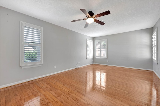 12706 Magnolia Bay Blvd, Clermont, FL 34711 - empty room with a textured ceiling, wood finished floors, and ceiling fan