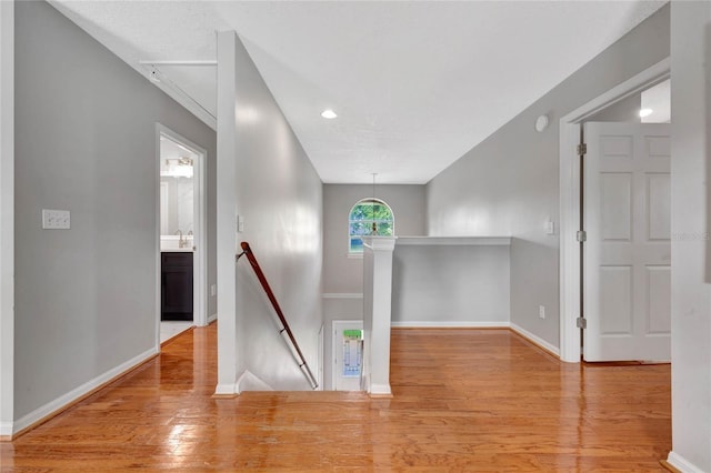 12706 Magnolia Bay Blvd, Clermont, FL 34711 - hallway featuring an upstairs landing, wood finished floors, and recessed lighting