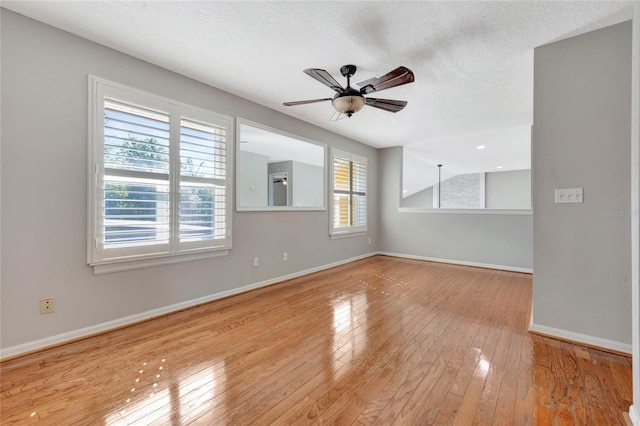 12706 Magnolia Bay Blvd, Clermont, FL 34711 - unfurnished room featuring hardwood / wood-style floors, a ceiling fan, and a textured ceiling