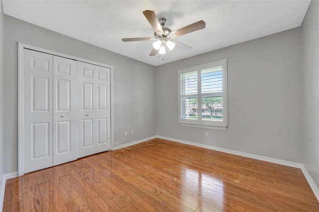 12706 Magnolia Bay Blvd, Clermont, FL 34711 - unfurnished bedroom featuring a closet, light wood-type flooring, and ceiling fan
