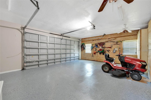 12706 Magnolia Bay Blvd, Clermont, FL 34711 - garage with ceiling fan and wooden walls