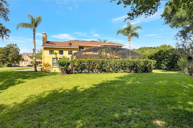 12706 Magnolia Bay Blvd, Clermont, FL 34711 - view of grassy yard with glass enclosure