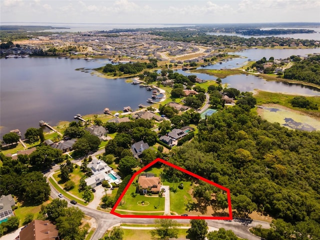 12706 Magnolia Bay Blvd, Clermont, FL 34711 - aerial view of residential area with a nearby body of water and property boundaries highlighted