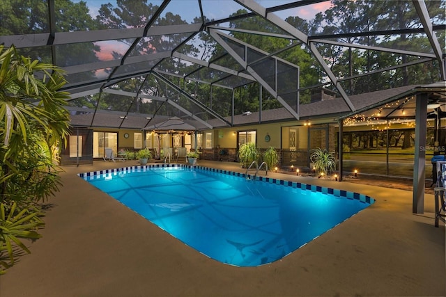 11160 SE 47th Ave, Belleview, FL 34420 - pool at dusk with a patio, a lanai, and an outdoor pool