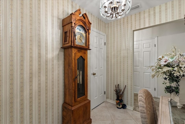 11160 SE 47th Ave, Belleview, FL 34420 - entrance foyer featuring wallpapered walls, visible vents, tile patterned flooring, and an inviting chandelier