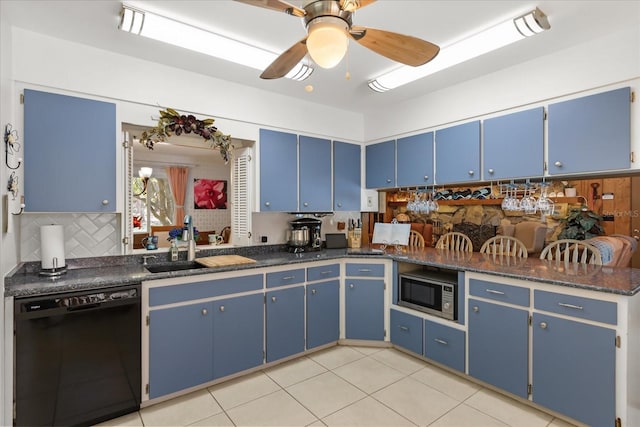 11160 SE 47th Ave, Belleview, FL 34420 - kitchen featuring a sink, tasteful backsplash, blue cabinets, dishwasher, and stainless steel microwave