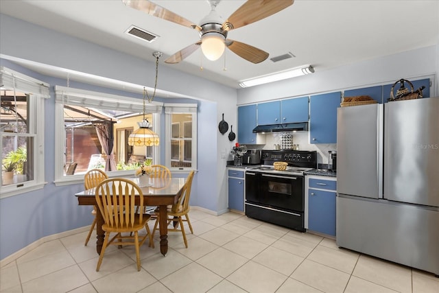 11160 SE 47th Ave, Belleview, FL 34420 - kitchen with visible vents, black / electric stove, under cabinet range hood, blue cabinets, and freestanding refrigerator