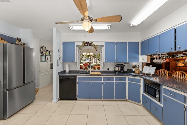 11160 SE 47th Ave, Belleview, FL 34420 - kitchen featuring blue cabinets, a sink, dishwasher, built in microwave, and freestanding refrigerator