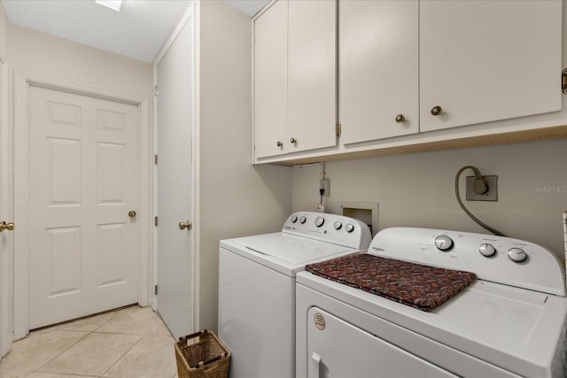 11160 SE 47th Ave, Belleview, FL 34420 - laundry room with light tile patterned flooring, washing machine and dryer, and cabinet space