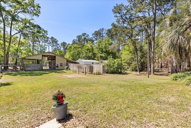 11160 SE 47th Ave, Belleview, FL 34420 - view of yard with an outbuilding and fence