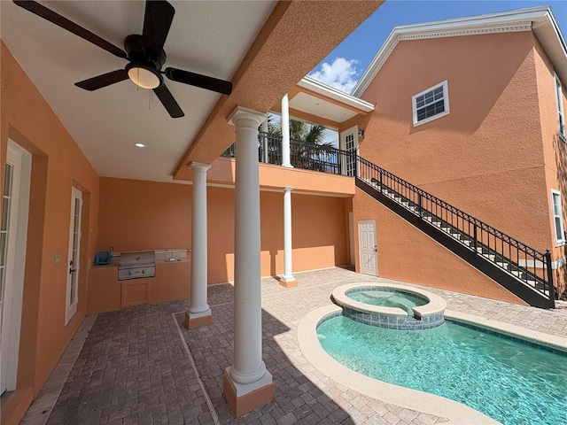 view of swimming pool with area for grilling, a patio, ceiling fan, and a pool with connected hot tub