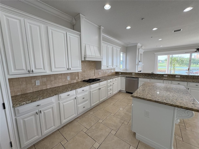 kitchen featuring white cabinets, custom range hood, stainless steel dishwasher, and black gas stovetop