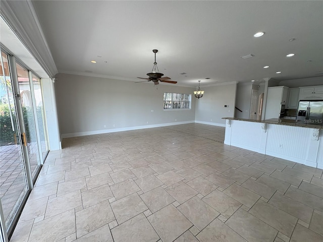 unfurnished living room featuring crown molding, baseboards, recessed lighting, and ceiling fan with notable chandelier