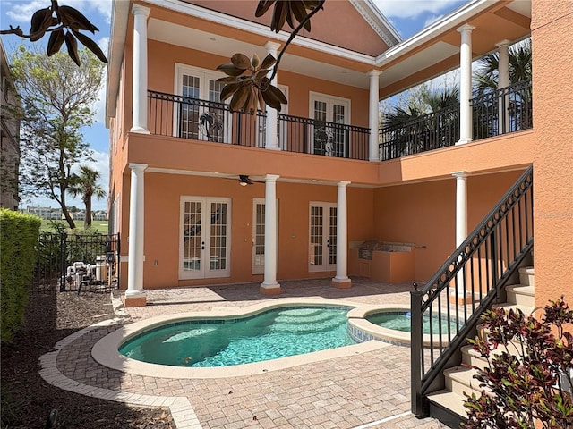 back of property featuring a patio, french doors, stucco siding, and ceiling fan