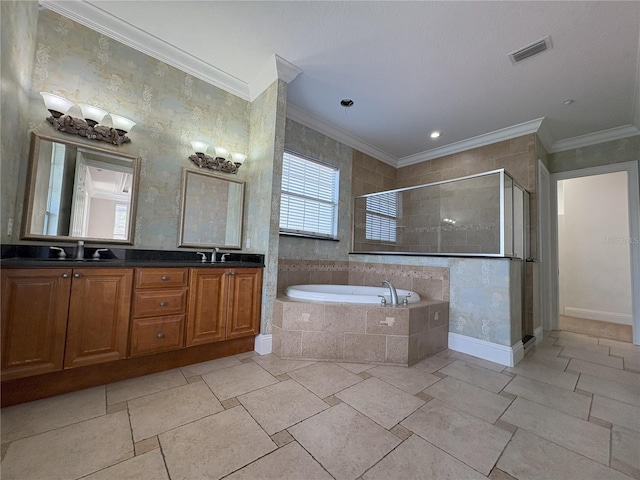 bathroom with visible vents, a sink, a garden tub, and a stall shower